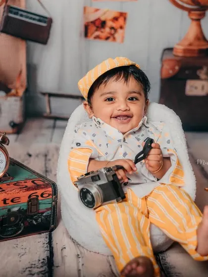A happy traveler with his camera. His joyful smile shows how much fun we have during our themed sessions.
