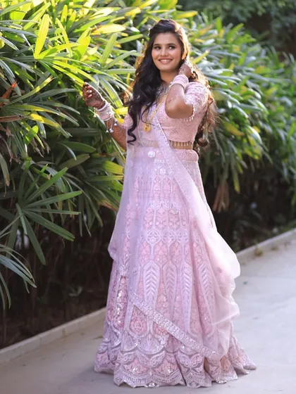 Pretty in pink and radiating joy. This intricately embroidered pink lehenga is a beautiful choice for an engagement shoot or a vibrant pre-wedding celebration, offering a modern take on traditional elegance.