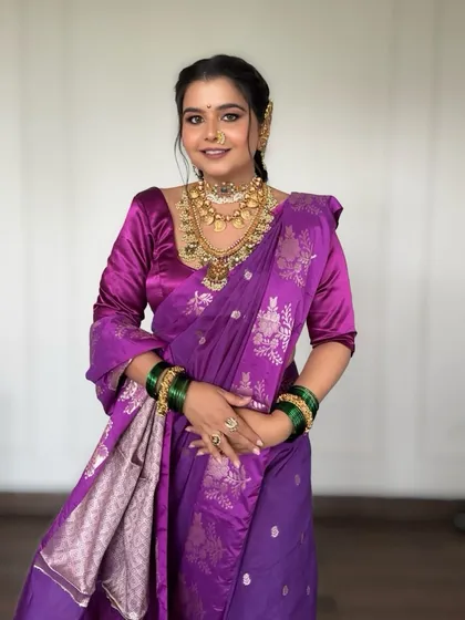A full view of the festive Maharashtrian look. The makeup balances tradition with elegance, featuring smoky eyes, bold lips, and luminous skin for a grand celebration.