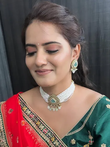 A detailed shot of the eye makeup. The soft, blended colors enhance her eyes while maintaining an overall look of natural elegance.