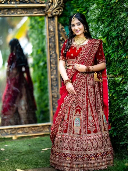 For a timeless and regal look, my red velvet lehenga is a top choice. It features intricate, heavy embroidery that looks luxurious on camera, and the rich velvet fabric adds depth and elegance. This is perfect for creating classic, heritage-themed pre-wedding portraits.