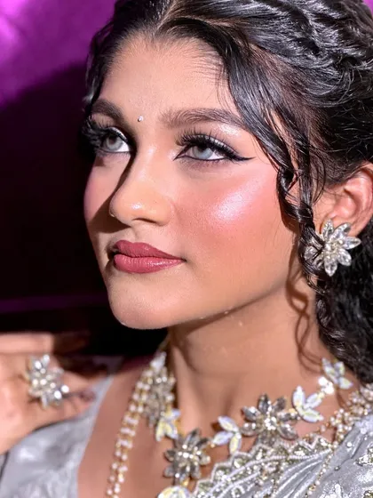 The flawless finish of airbrush makeup is undeniable. This look features a sharp winged liner and glowing skin, perfect for a bride who wants that extra touch of perfection and longevity for her wedding day photos and events.