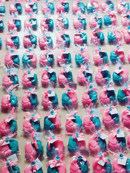 A large batch of the baby feet soaps, packaged and ready for a baby shower event.