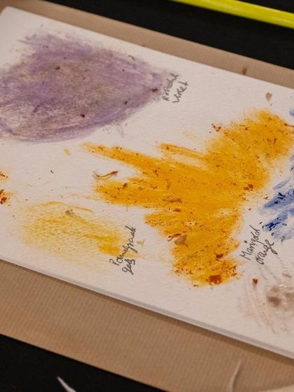 An abstract painting created with handmade botanical inks. The textures and hues from marigold, bougainvillea, and butterfly pea flowers come together to form a unique piece of natural art.