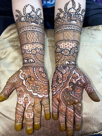 A traditional bridal design featuring elephants and palanquins (doli). The patterns are classic and tell the story of a wedding procession.