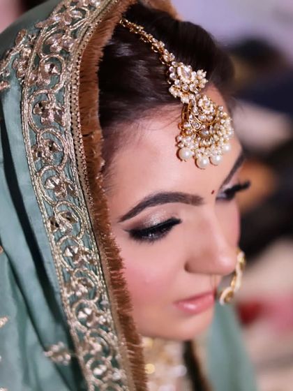 A soft and beautiful Anand Karaj look. The makeup is kept minimal to suit the morning ceremony, with a focus on creating a flawless base and enhancing the bride's natural glow.