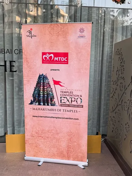 Custom-designed standee banners, like this one for the Mahakumbh of Temples, provide clear information and consistent branding throughout the convention venue.