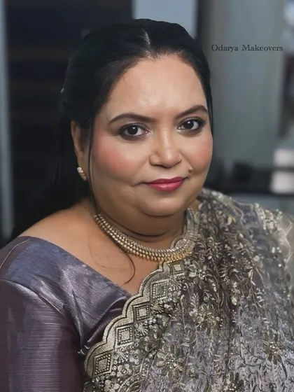 A beautiful portrait of the bride's mother. The makeup is soft and sophisticated, perfect for a reception party.
