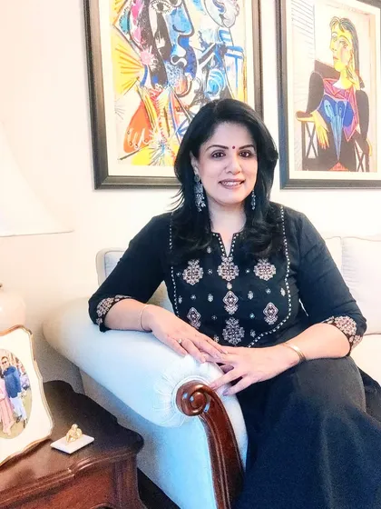 Seated on the couch in my comfortable black kurta set. This outfit is perfect for an evening at home or a casual dinner out.