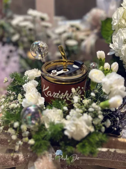 A personalized candle with the founder's name, Karishma, takes center stage in this brand launch hamper. It’s a beautiful example of how a single custom item can make a gift truly unique.