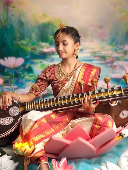 Another beautiful angle of our Saraswati theme, showcasing the intricate details of the costume and the serene backdrop.