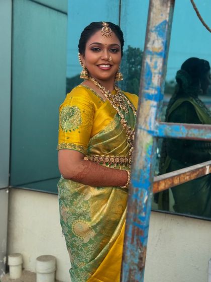 Another candid outdoor shot, showing Prithivi's bridal look from a different angle. The makeup remains flawless, proving its durability and photogenic quality.