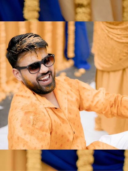 A candid shot of the groom, Akshat, laughing as he gets covered in Haldi, capturing the fun-loving spirit of the event.