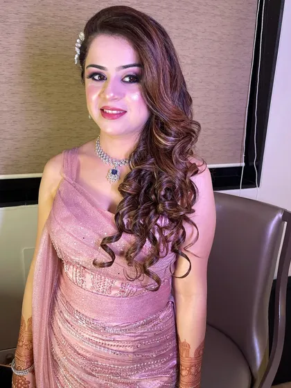 Another angle of this beautiful cocktail glam. The side-swept curls and the shimmery makeup create a look that is perfect for any evening event.