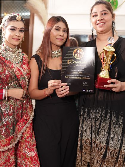 Presenting a certificate and trophy to one of the top students of the batch. Her work was outstanding.