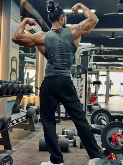 Building a strong back is crucial for posture and overall strength. This pose showcases the result of dedicated training on back and shoulder muscles.
