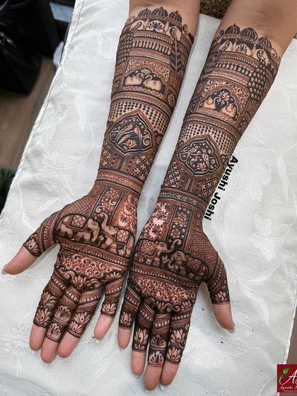A slightly different angle of the dense, figure-free bridal design, showcasing the flow and symmetry of the patterns across both hands.