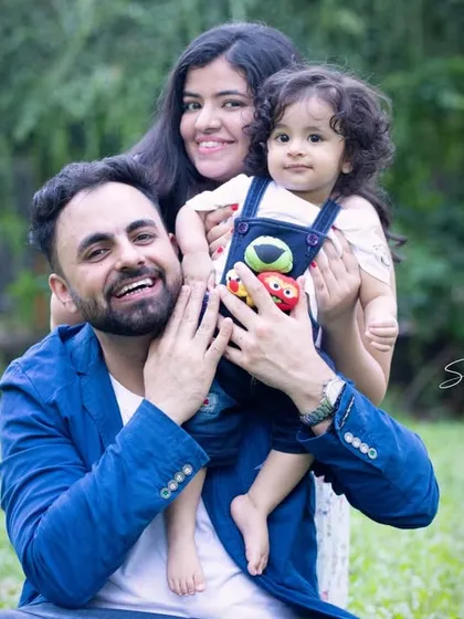 A happy family portrait with everyone looking at the camera. Even in a candid outdoor session, we can capture some lovely posed shots that you will cherish.