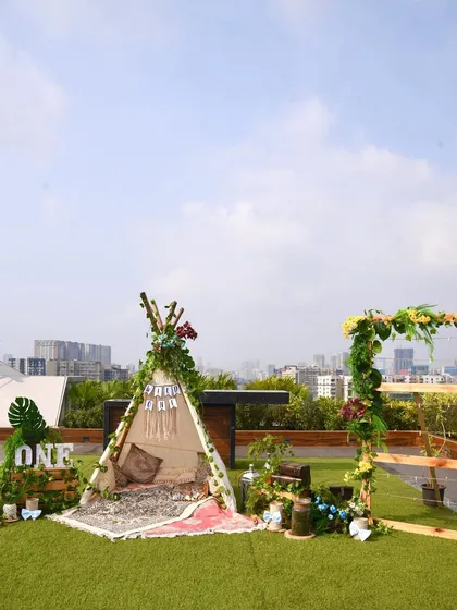 The full view of the "Wild One" rooftop setup. It included a teepee play area, a photo frame for memories, and plenty of greenery to create a mini jungle in the city.