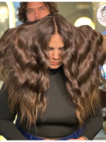 Showing off the volume and beautiful waves of this transformative brown hair color.