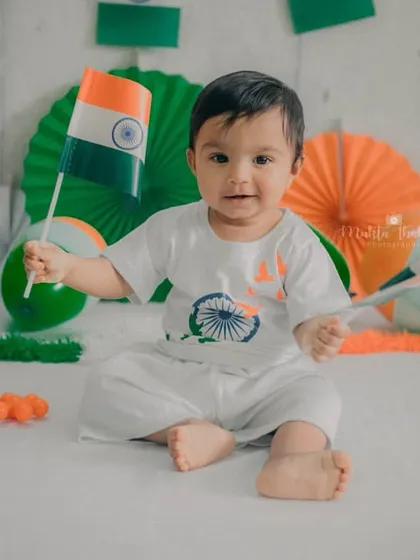 Holding two flags, because one is just not enough to show his patriotic spirit. Happy Independence Day.