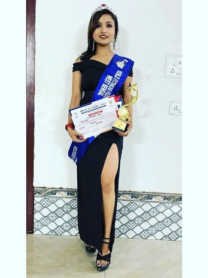 Another photo celebrating my win. This achievement represents countless hours of dedication in the gym and a commitment to my fitness journey.