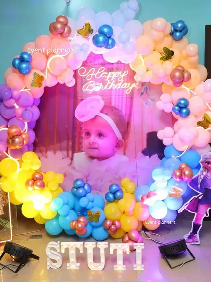 A colorful Frozen-themed birthday with a custom photo backdrop and marquee letters.