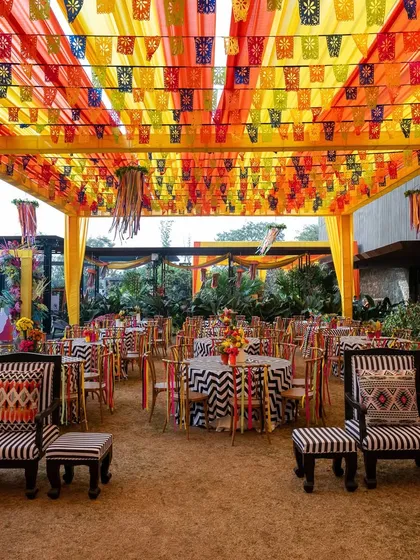 A wider view of the carnival seating arrangement, showcasing the scale and vibrant energy of the outdoor event.