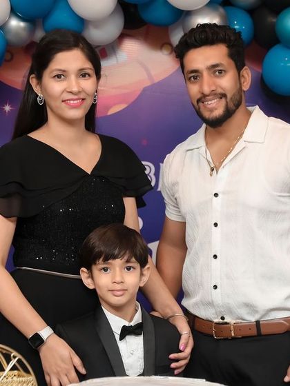 A stylish family portrait at a space-themed 5th birthday party. We work with families to get both formal and candid shots that reflect their personality and the fun of the day.