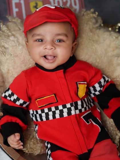 A winning smile from our future champion. I love capturing a range of expressions during our session, from sleepy pouts to happy, awake giggles, all within the fun context of a creative theme.