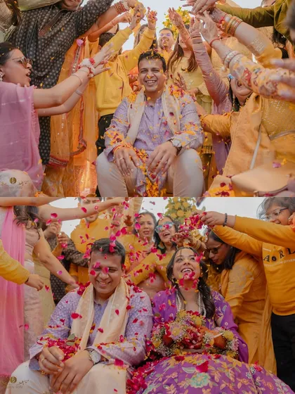 The sheer joy of a 'phoolon ki haldi' ceremony. We live for these moments of pure, uninhibited celebration, where family and friends shower the couple with love and flower petals. This vibrant image captures the energy and tradition of a pre-wedding ritual.