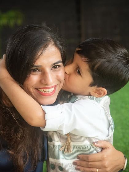 A sweet birthday kiss for mom. These are the precious, fleeting moments that you'll want to remember long after the party is over.