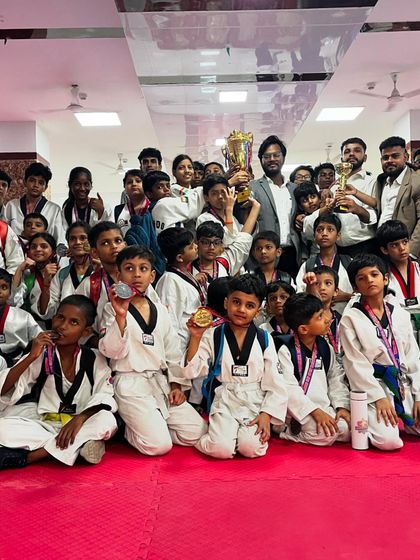 The whole team celebrating with their trophies and medals. The joy of victory is best when shared with your teammates who trained alongside you.