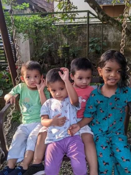 Cousins enjoying Christmas time together. One of the girls is wearing our teal Christmas print pyjama set, perfect for holiday gatherings.