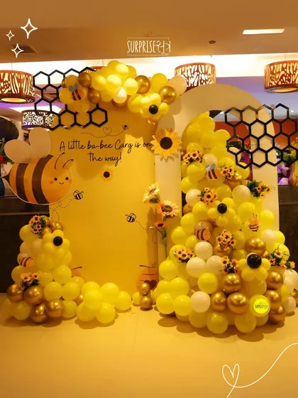 A baby shower should be full of fun and personality. This "A little ba-bee is on the way" theme was buzzing with joy, featuring a honeycomb backdrop, cheerful yellow balloons, and adorable bee details throughout the setup.