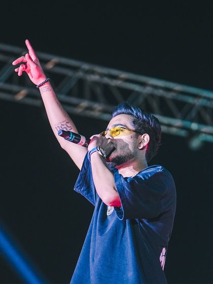 Rapping on the mic during my set at Parul University. This is what makes my service unique: a seamless blend of a live DJ set and a rap performance.