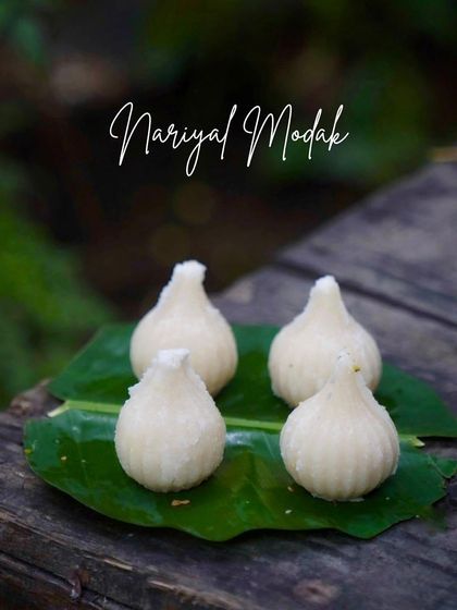 The classic Nariyal Modak, made with fresh coconut and jaggery. These steamed dumplings are a traditional offering for Lord Ganesha.
