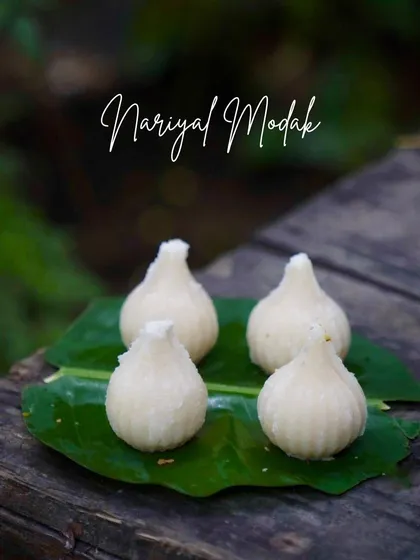 The classic Nariyal Modak, filled with a sweet and fragrant coconut stuffing. It's a traditional favourite for a reason.