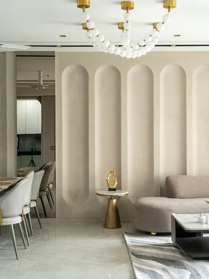 Quiet luxury is all about the details. Here, we used soft, sculptural wall niches to add architectural rhythm to the space. Paired with a warm neutral palette and subtle gold and marble accents, the design feels sophisticated and perfectly balanced.