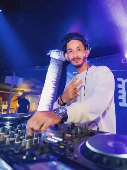 A candid shot of me smiling at the console at Cafe Mambo. I genuinely love my job and enjoy seeing people have a good time.