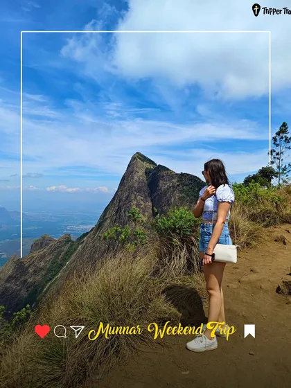 An Insta-worthy shot of a woman overlooking the stunning mountain peaks of Munnar. My trips are designed to take you to the most photogenic spots.