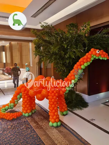 Another look at our life-sized dinosaur balloon sculpture, placed in a hotel lobby to welcome guests to a prehistoric-themed party. It's an instant 'wow' moment.
