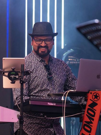 Our keyboardist Solomon, all smiles during the Bengaluru Ganesh Utsava performance. His joy is infectious and reflects the fun we have on stage as a band.