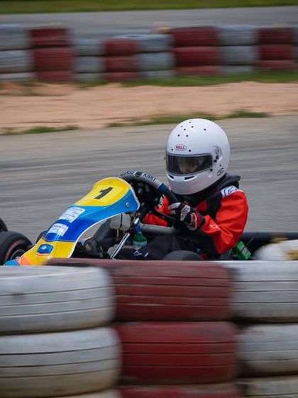 A Micro driver navigates a corner with focus and determination.