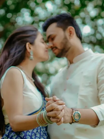 An almost-kiss, full of tenderness. This close-up of Umesh and Janhavi holding hands captures the deep intimacy and romance of their bond.
