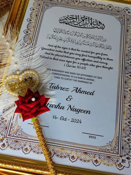 That beautiful feeling when you complete half of your Deen. This framed Nikah certificate, with its ornate gold frame and a decorative feather pen, is designed to be a cherished keepsake of your sacred union.