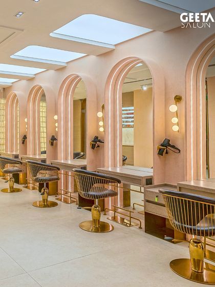 The main styling floor at Shilp Shivalik, with its high ceilings, skylights, and soft pink arches creating a bright and airy space.