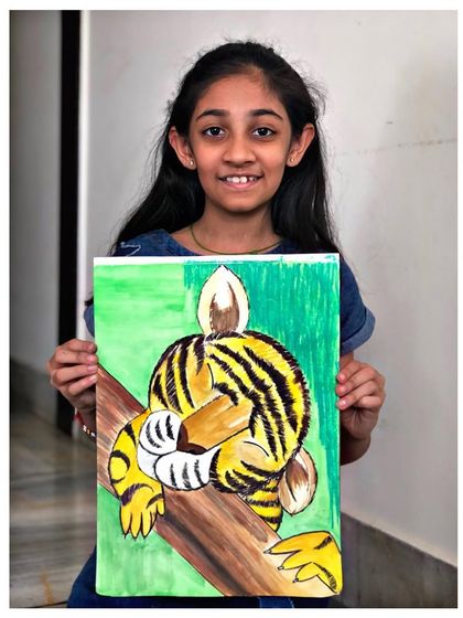 The proud artist with her finished watercolour painting of a sleeping tiger. Her gentle handling of the medium is wonderful to see.
