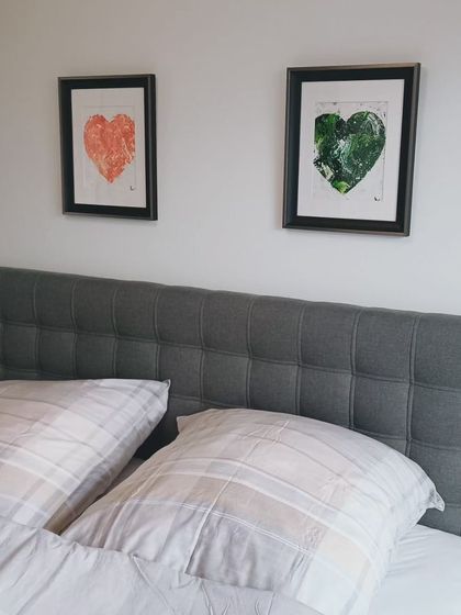 A wider shot of the red and green hearts in this client's bedroom. It's always so nice to get pictures of my art adorning the homes they go to.