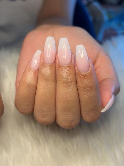 A close-up of the seamless blend on the milky white ombré nails.